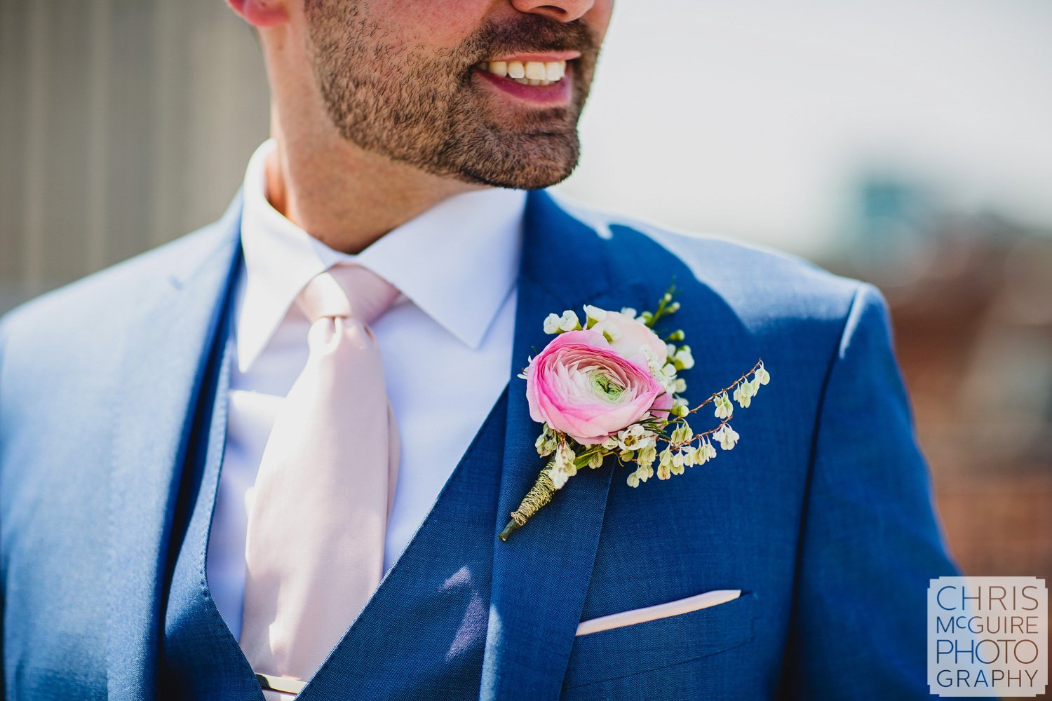 groom blue suit pink flower boutonniere