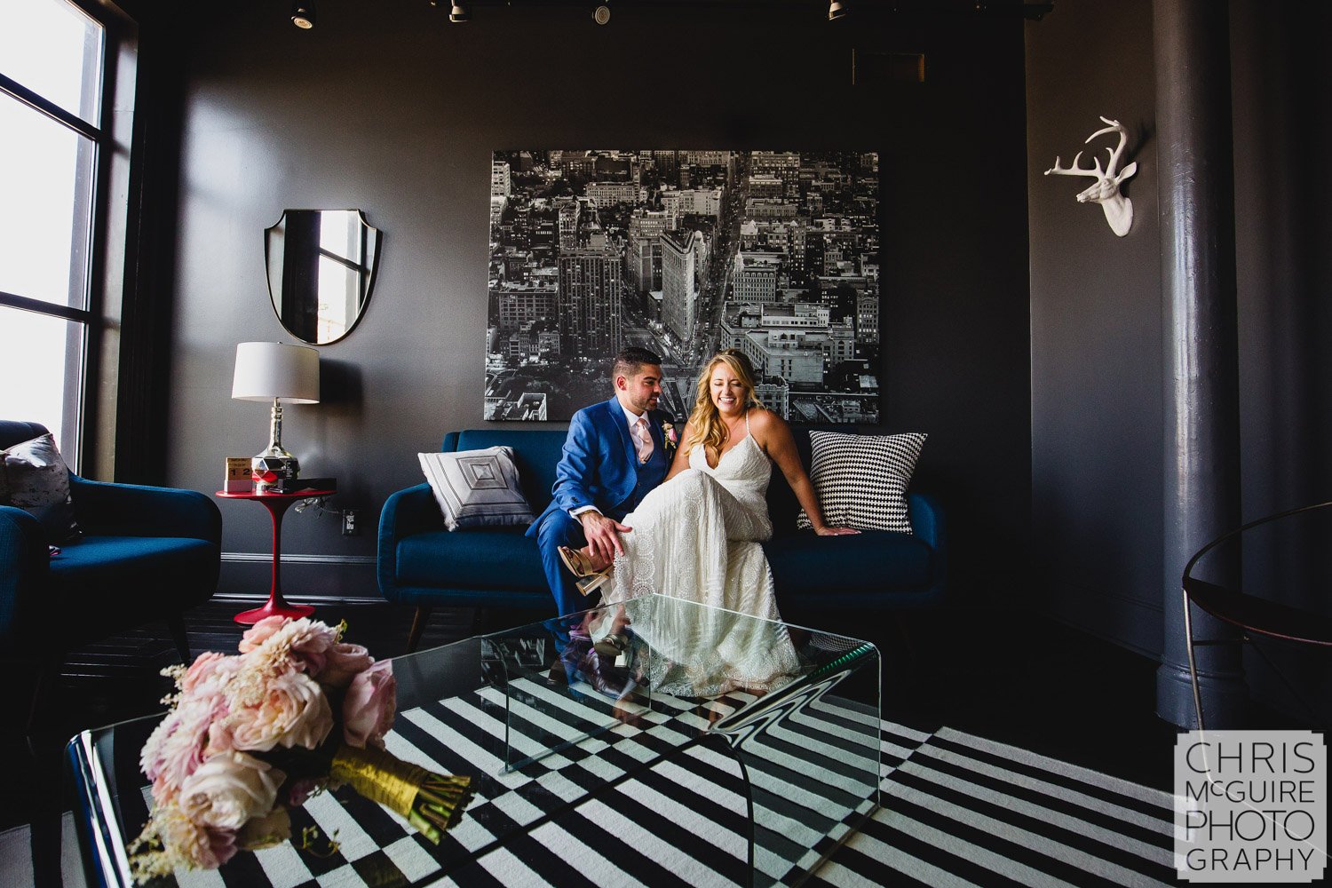 bride laughing with groom inside portrait