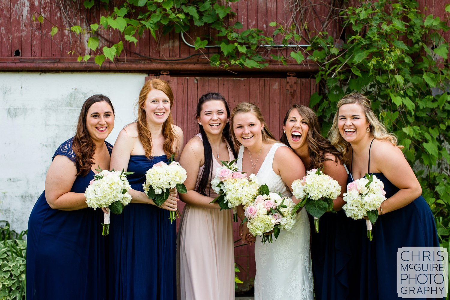 bride laughing with bridesmaids