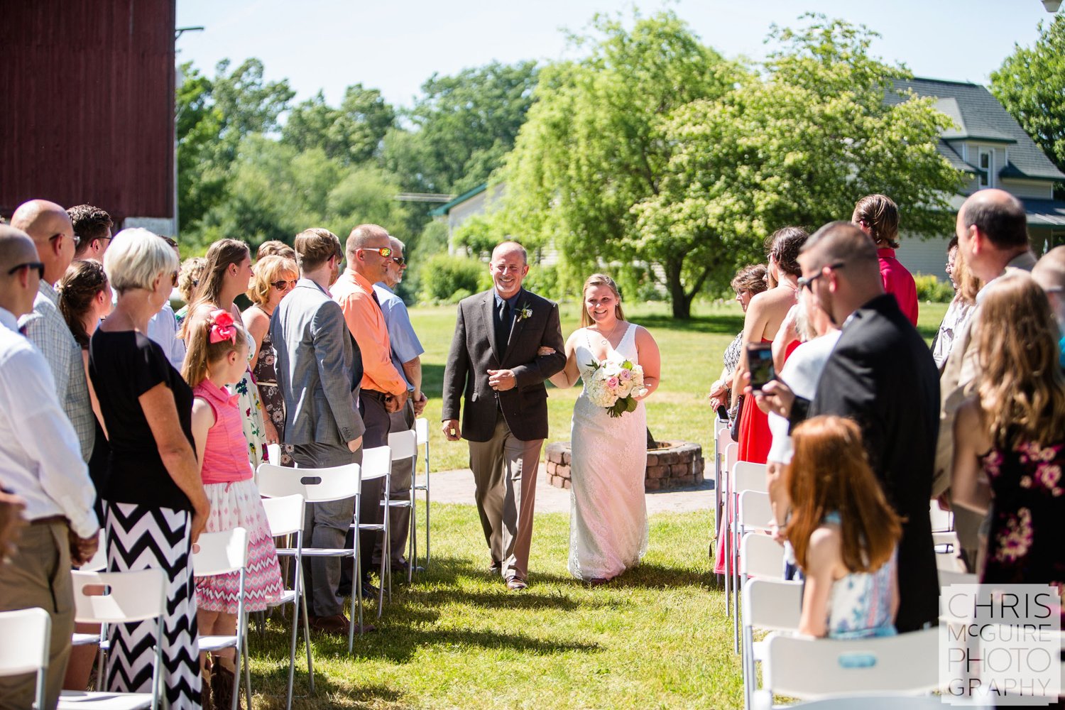 bride with father walking down aisle at wedding