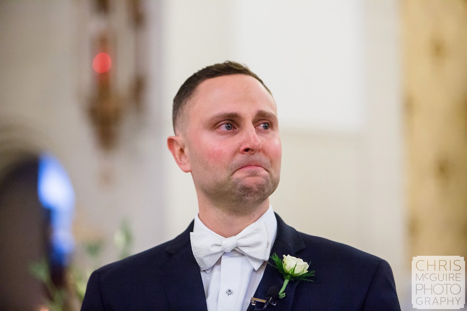 groom crying as he sees bride first time at wedding