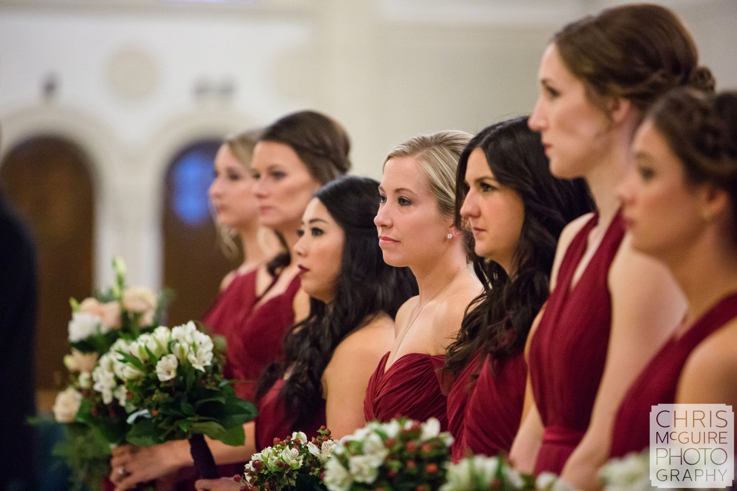 bridesmaids in red dresses at wedding