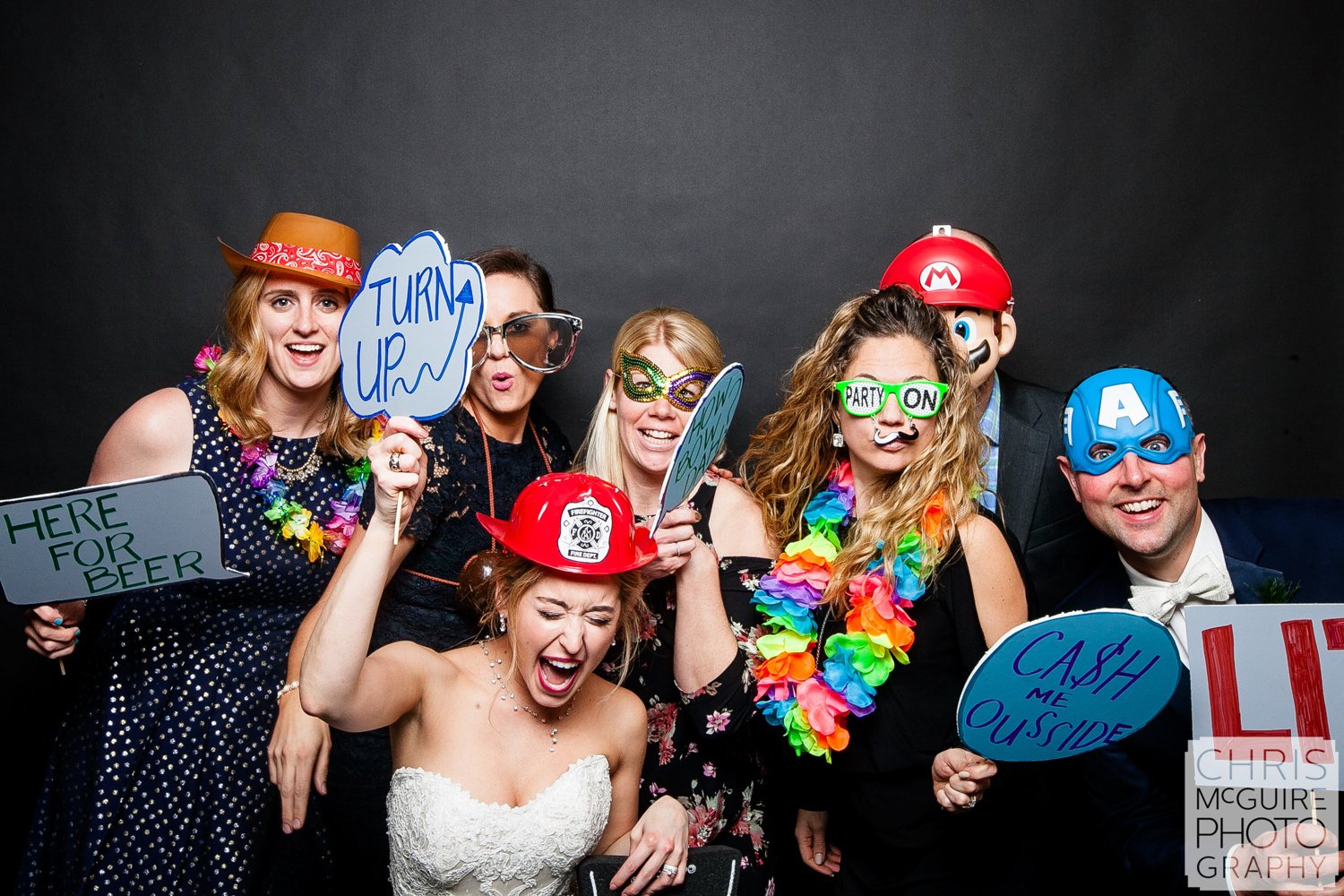 bride in photo booth with friends