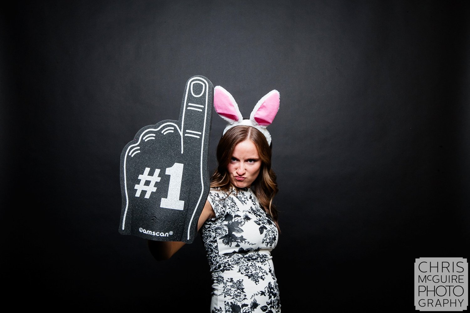 woman with bunny ears in wedding photo booth