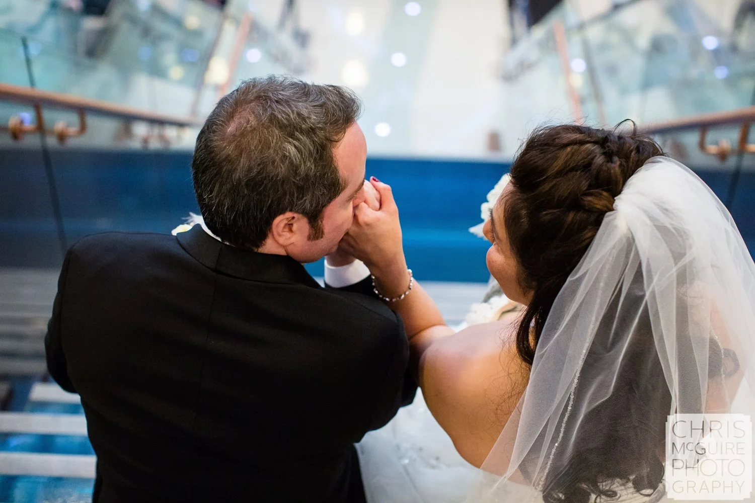 bride groom kissing hand