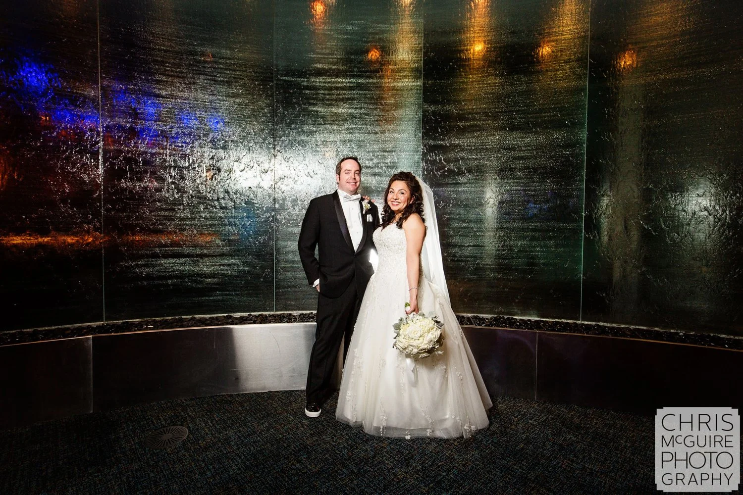 bride groom waterfall wall