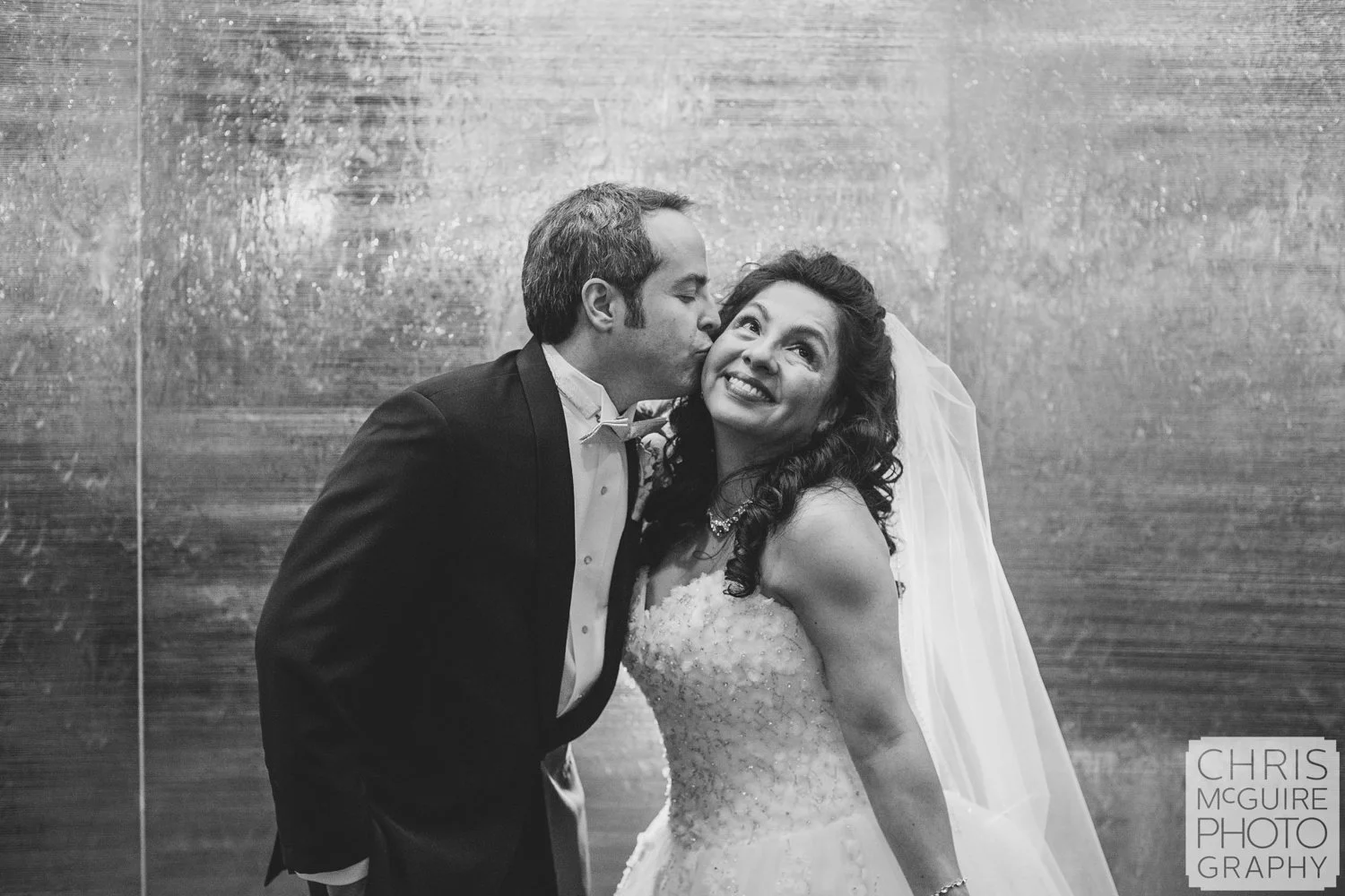 groom kissing bride casino wedding