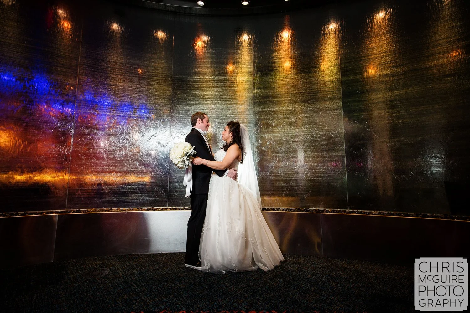 bride groom waterfall wall in casino wedding
