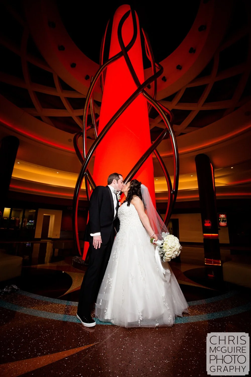 bride groom kiss at firekeepers casino wedding
