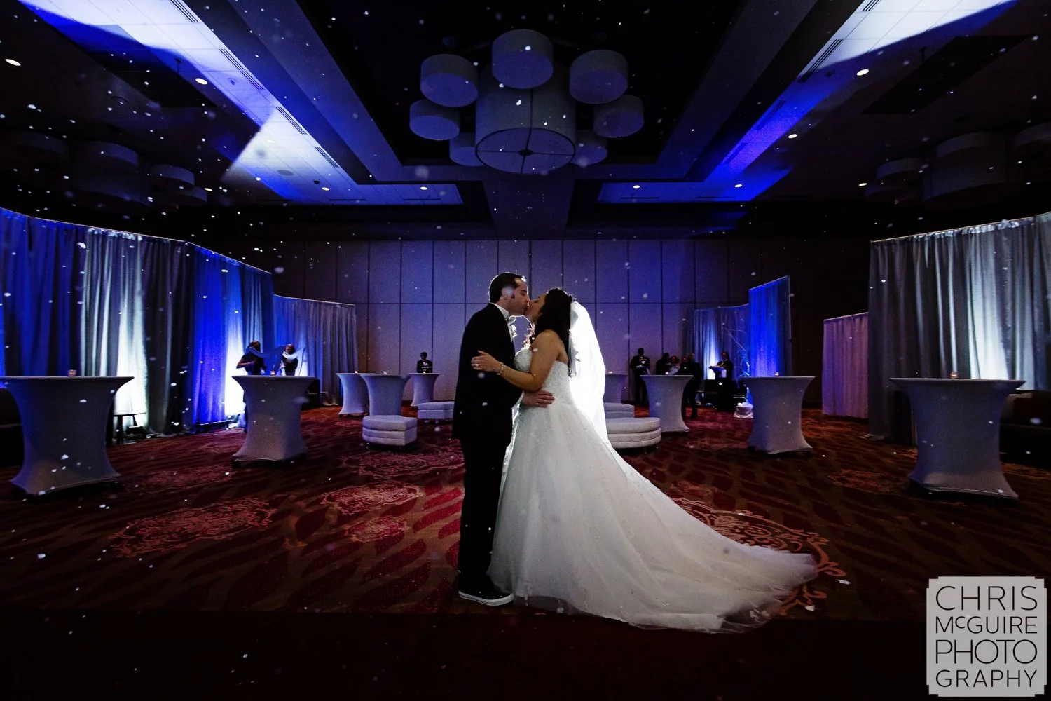 bride groom kiss ballroom snow machine 