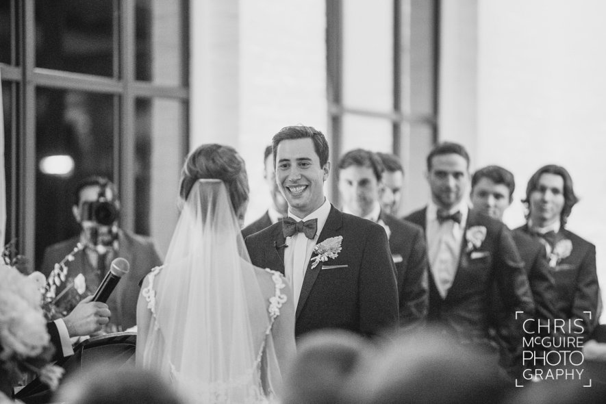 groom smiling indoor wedding