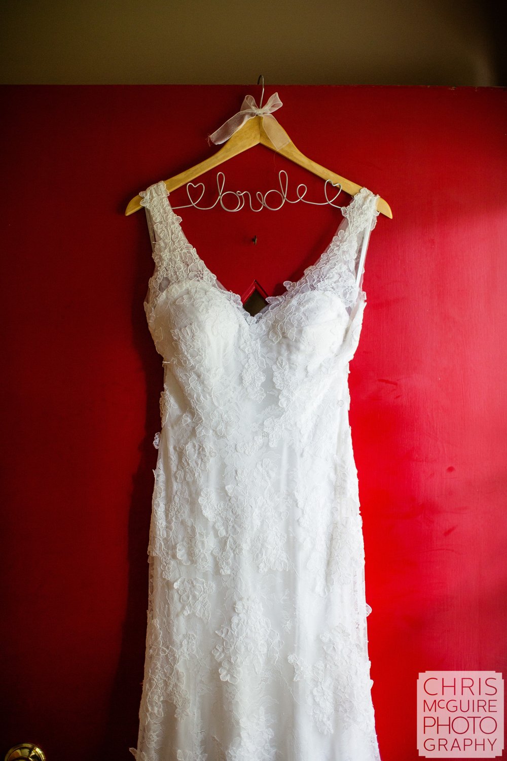 wedding dress on red door