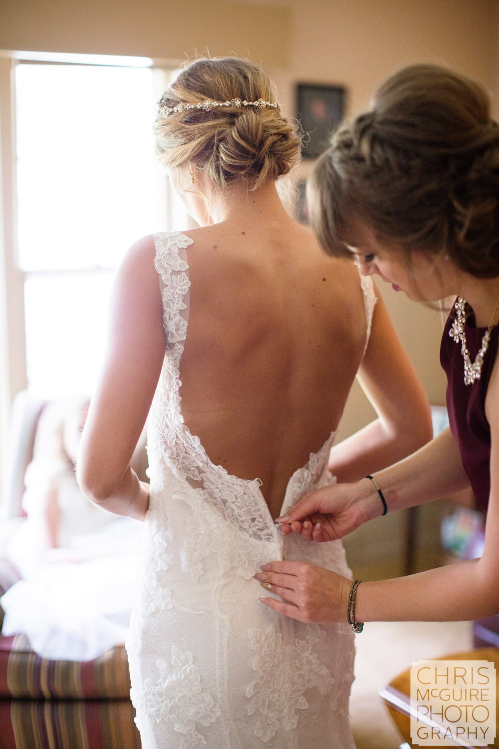 bride zipping dress peoria