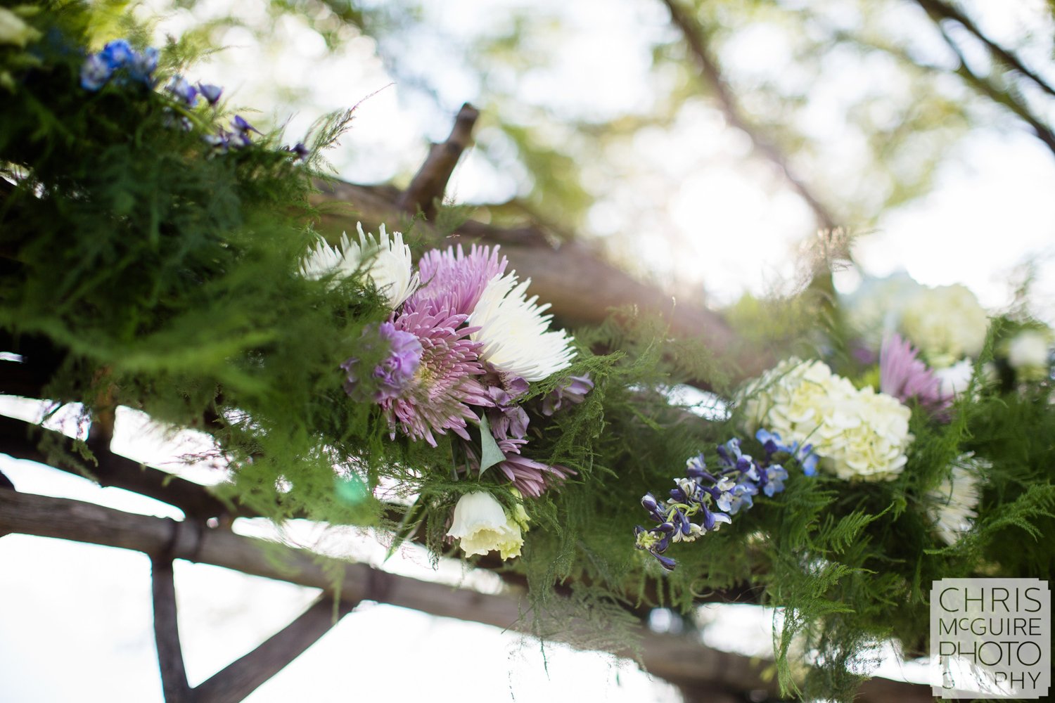 wedding alter outside purple flowers