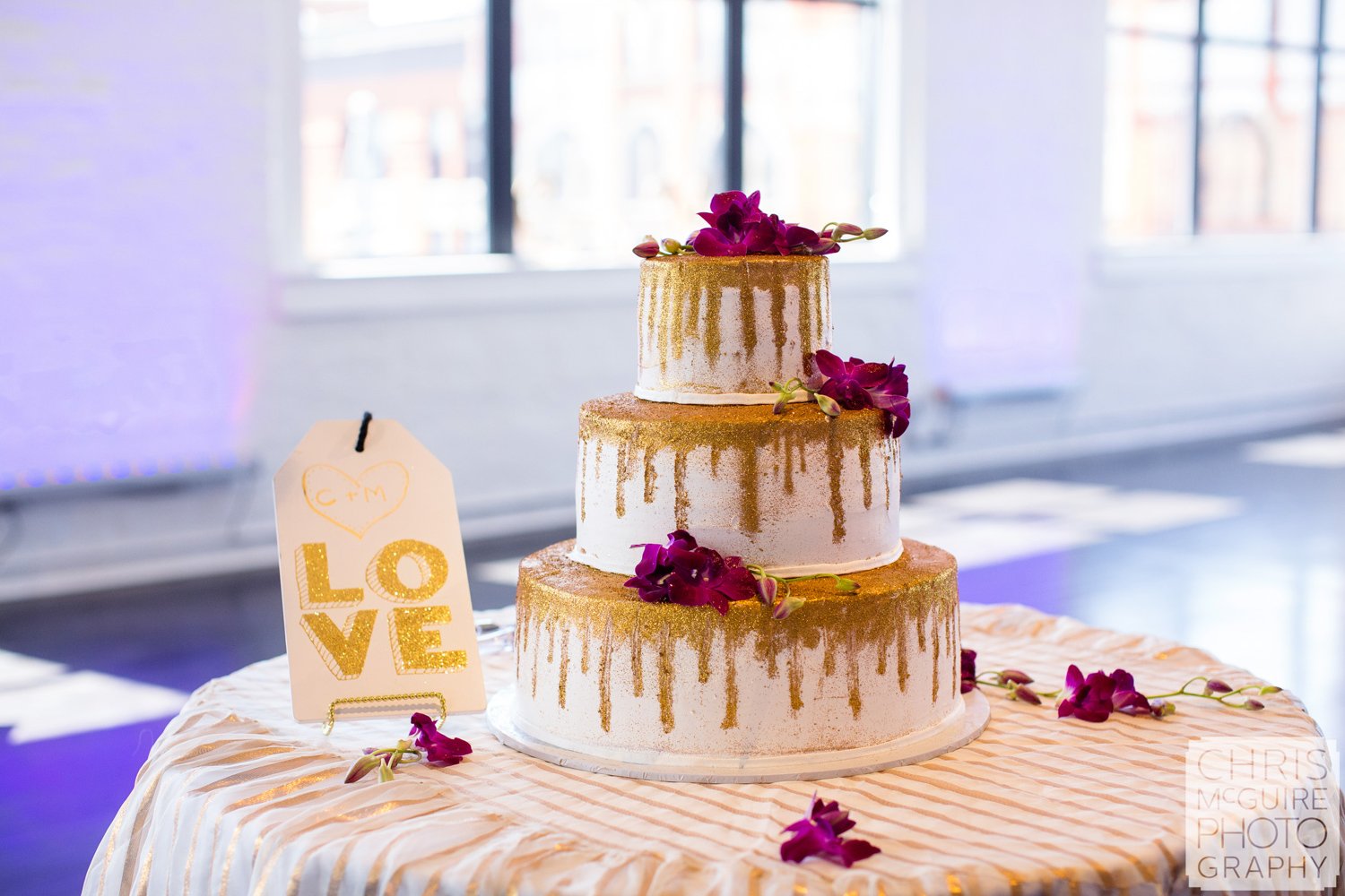 gold wedding cake in loft
