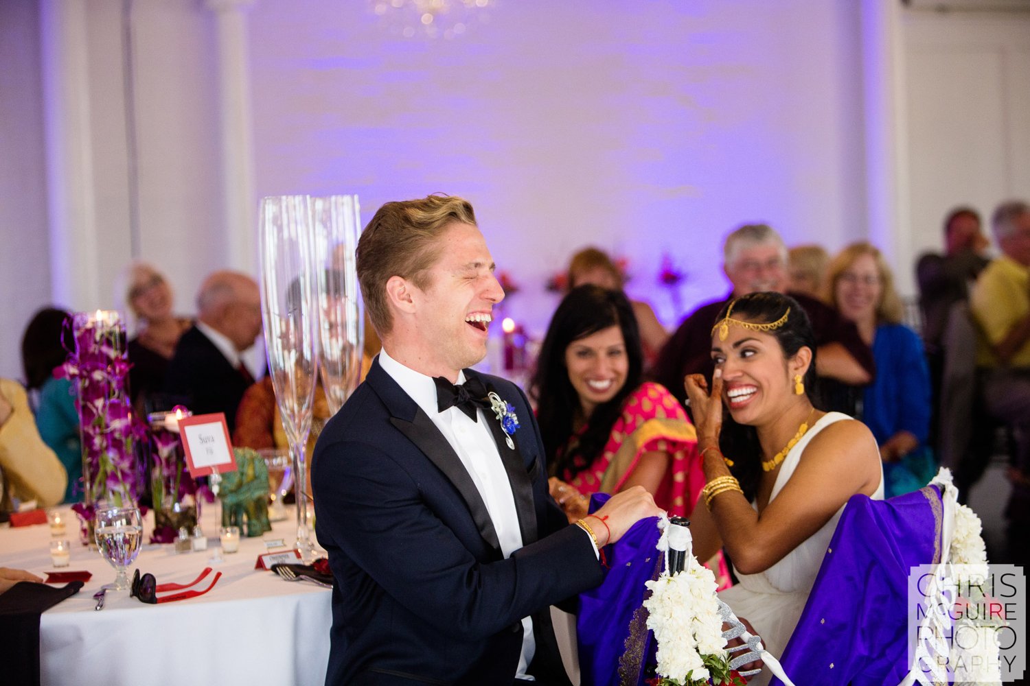 bride groom laughing during wedding toast