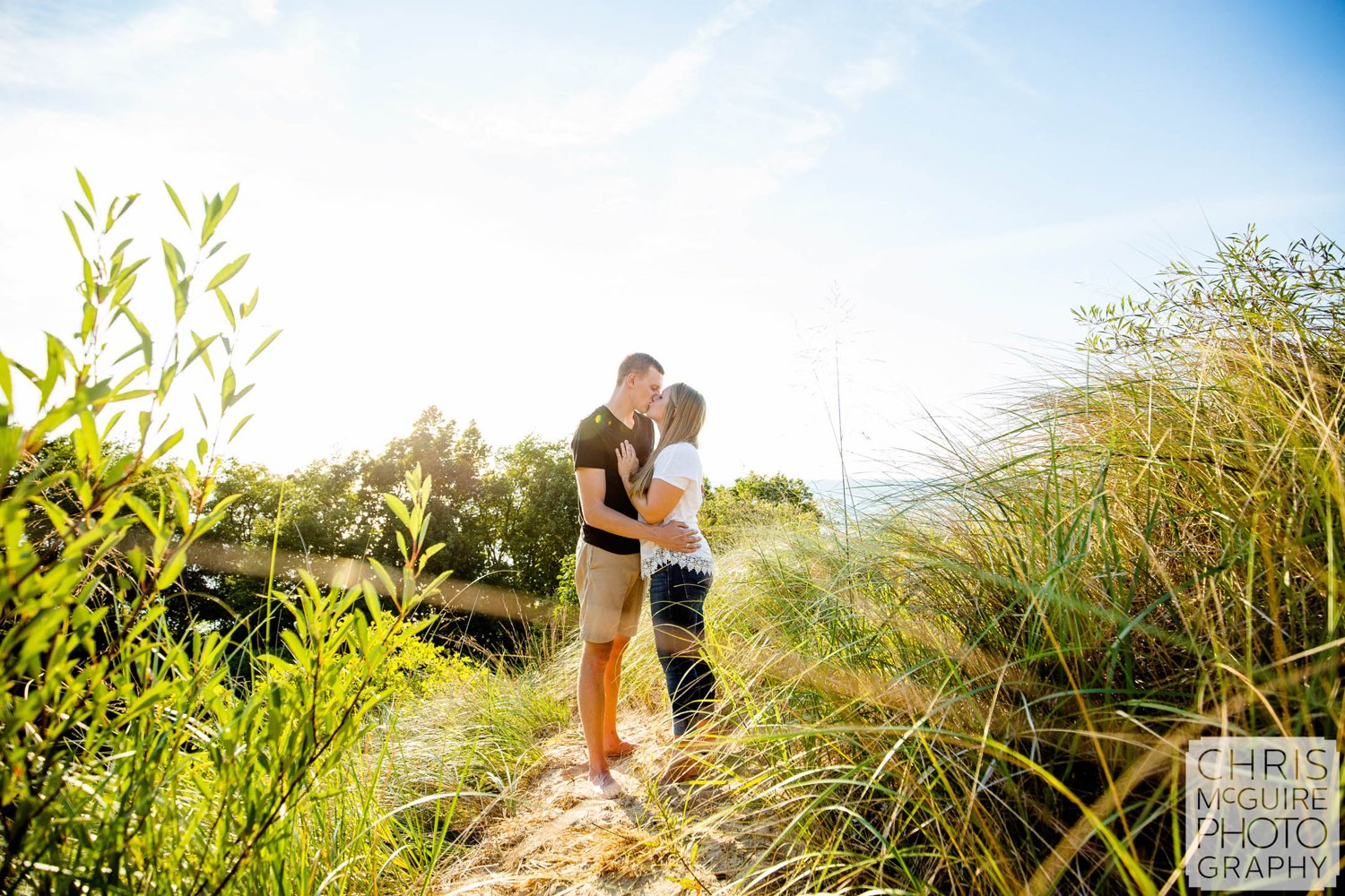 couple kissing by beach