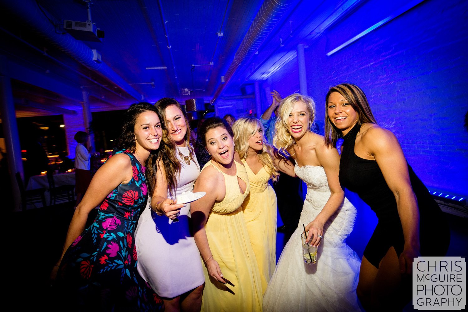 bride with friends at wedding reception