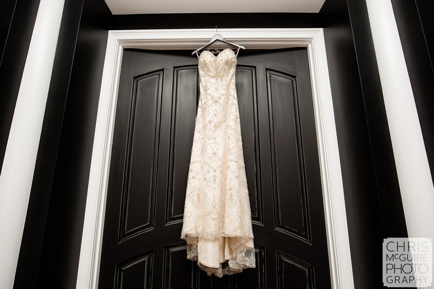 wedding dress on black door