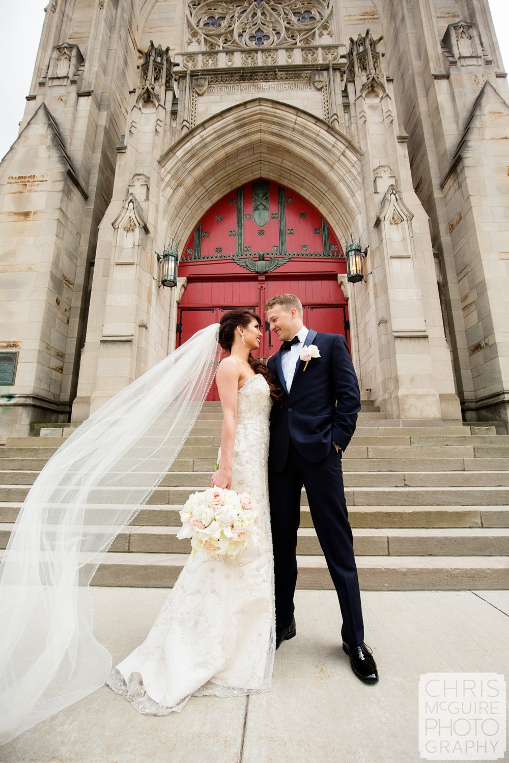 bride groom red door veil flying