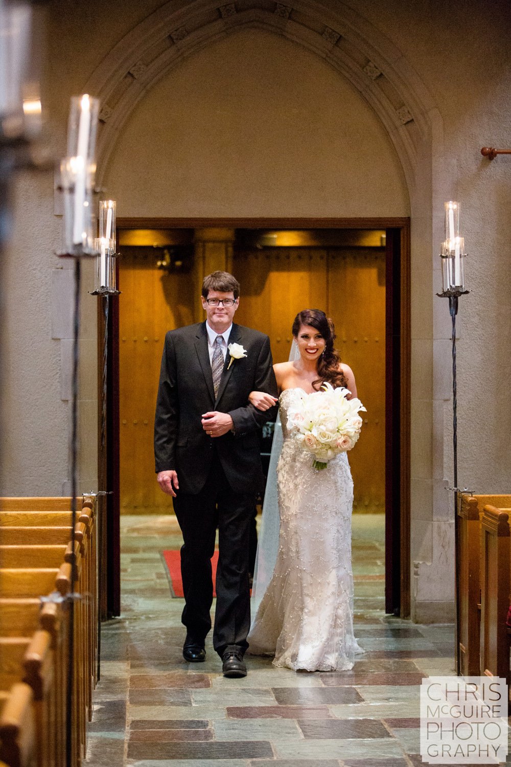 bride walking down aisle with father