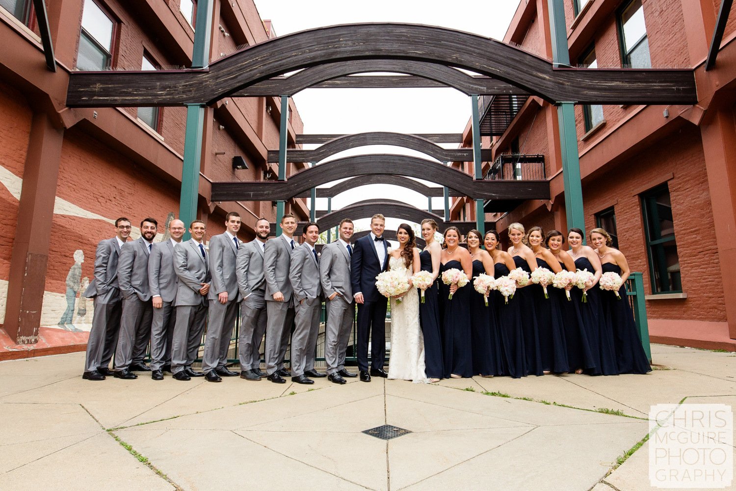 wedding party under arches