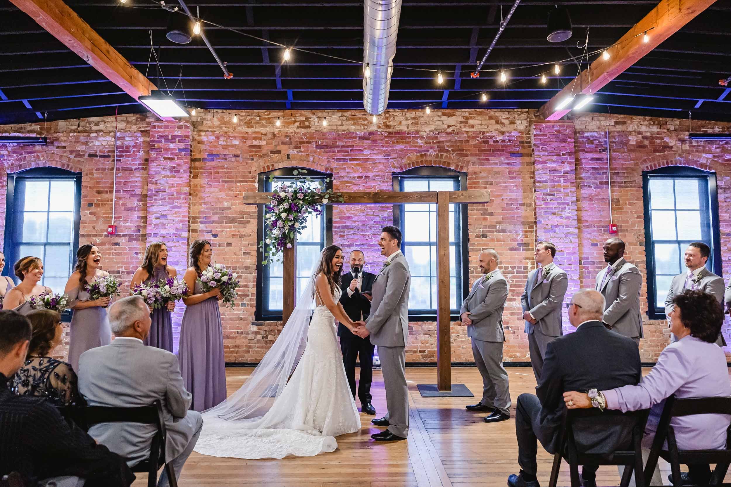Bride laughs during wedding ceremony at Trailside in Peoria, Illinois