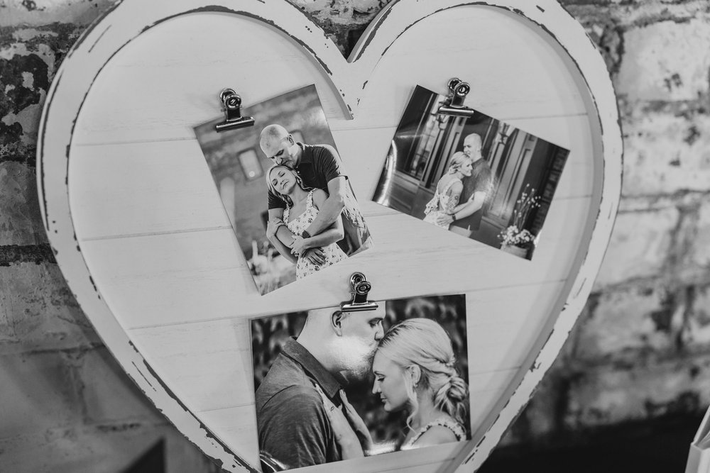 Engagement portraits on display at wedding reception