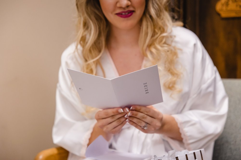 Bride reads note from groom