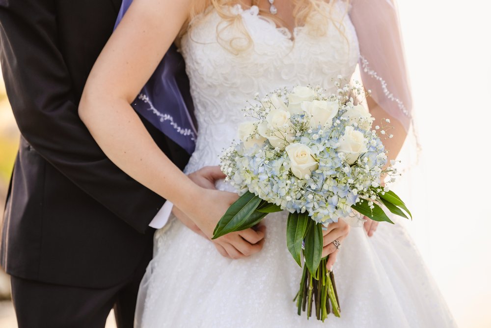 Bride and groom with bridal bouquet