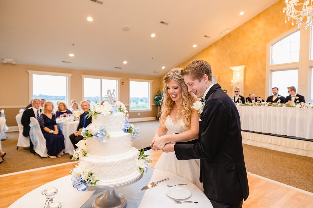 Bride and groom cut cake at Metamora Fields