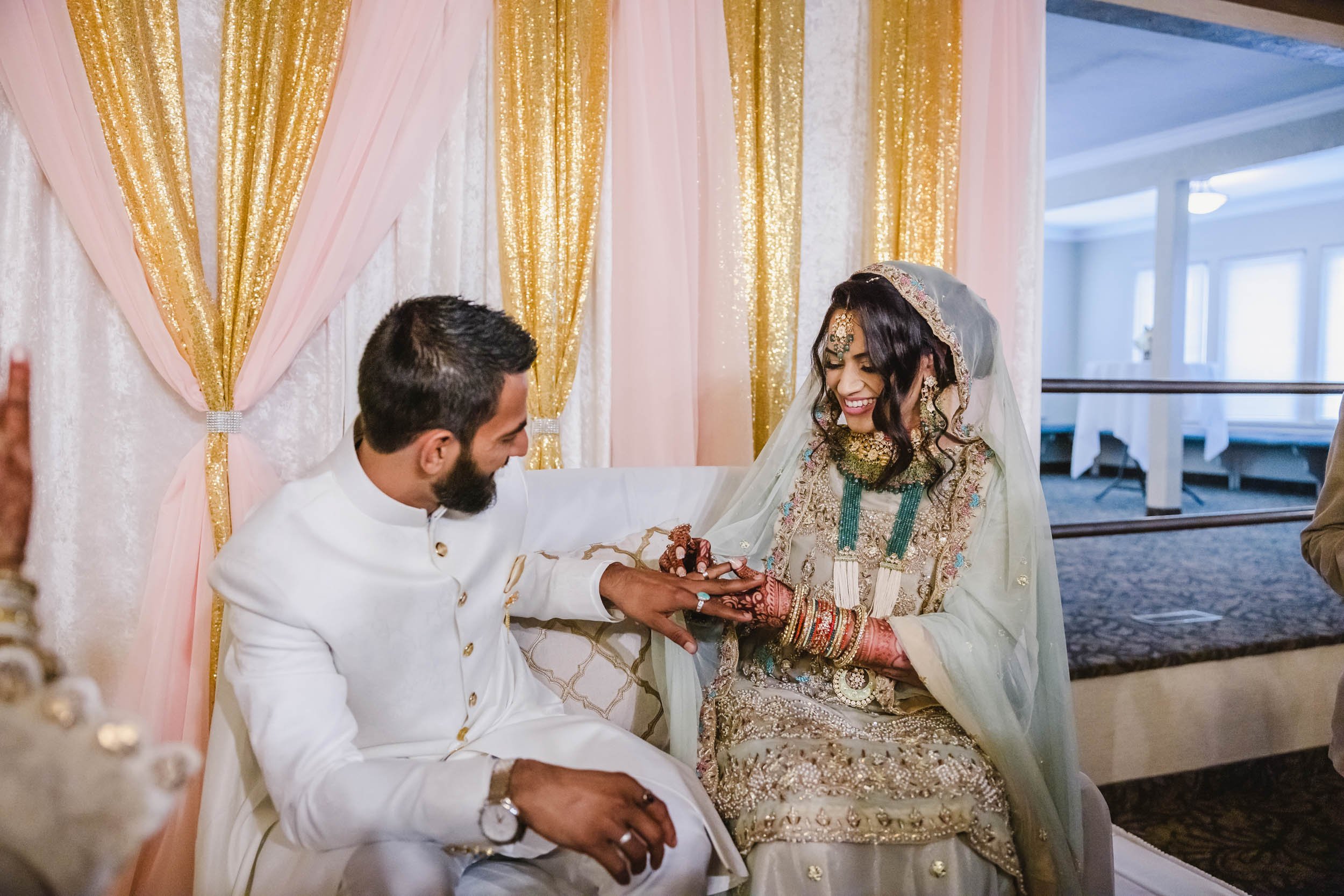 Muslim bride and groom exchange rings