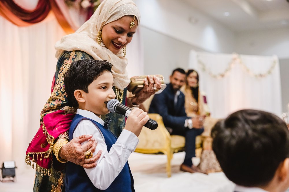 Muslim wedding reception child gives toast
