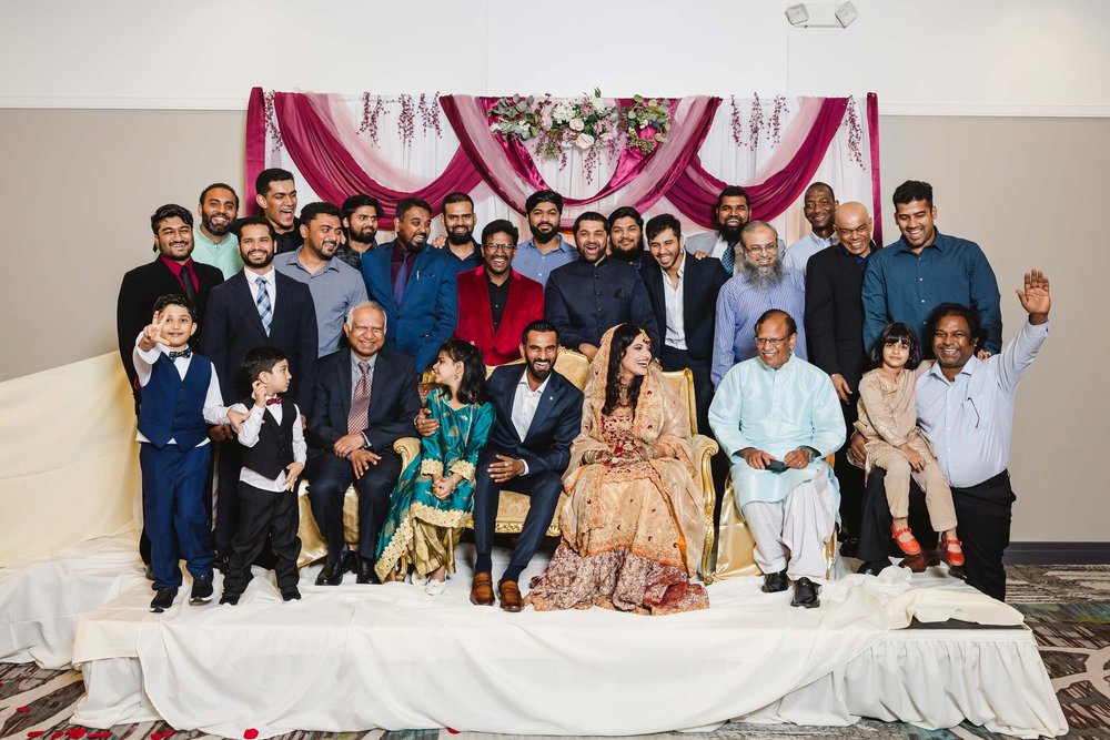 Group portrait at Muslim wedding reception