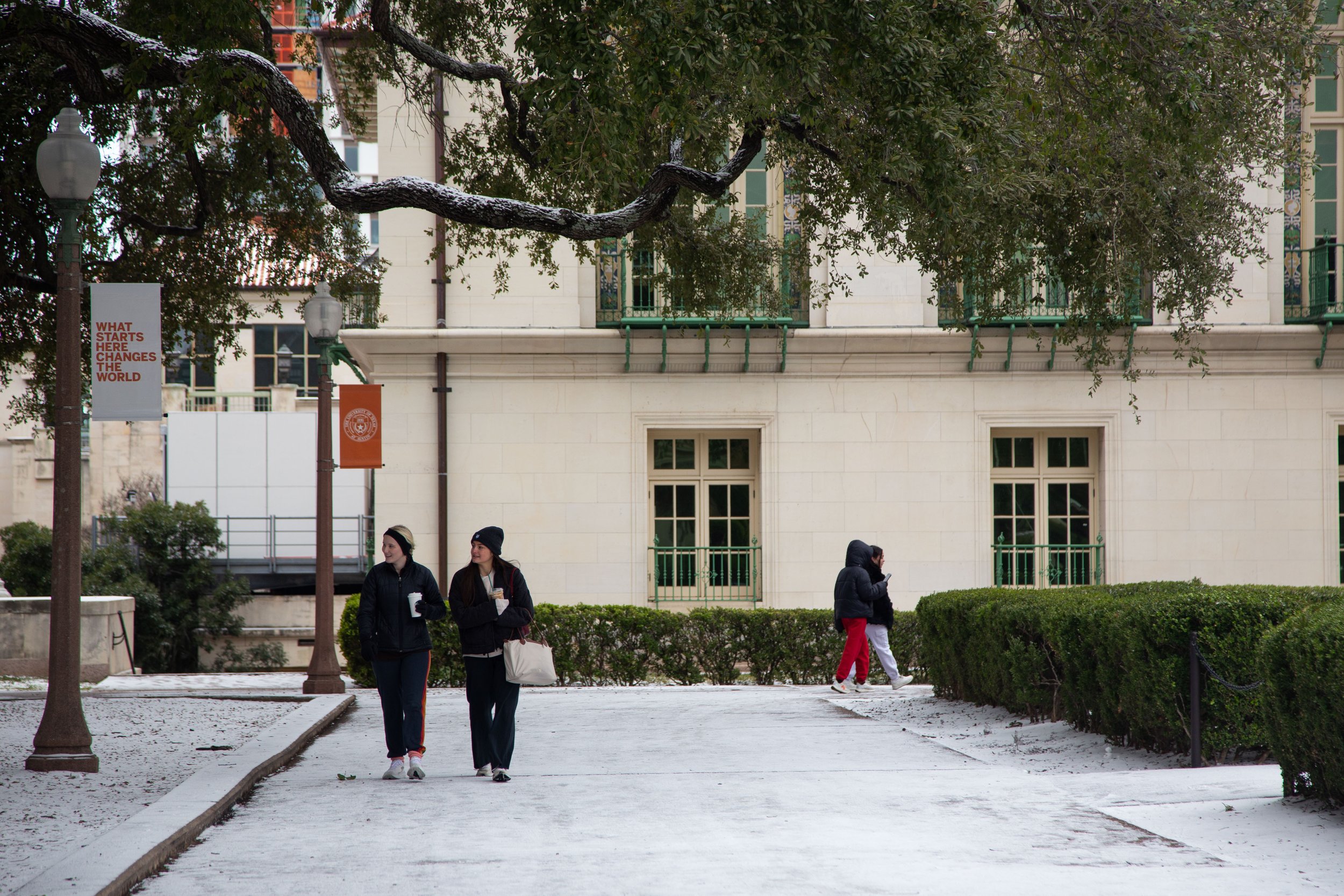 People walk on the Main Mall after overnight snowfall canceled classes on Jan. 21, 2025.
