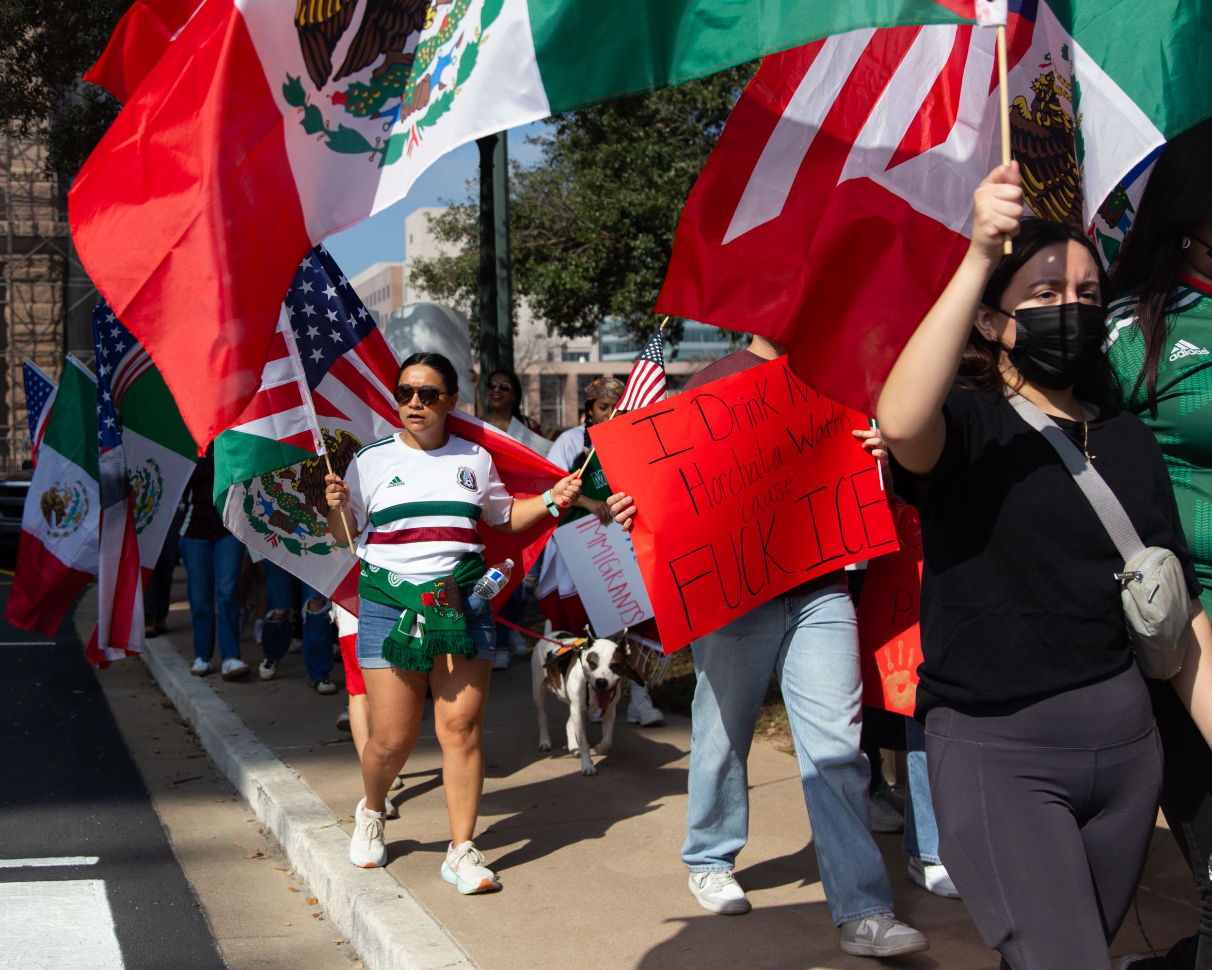 Protesters march by the Texas State Capitol on Feb. 8, 2025.