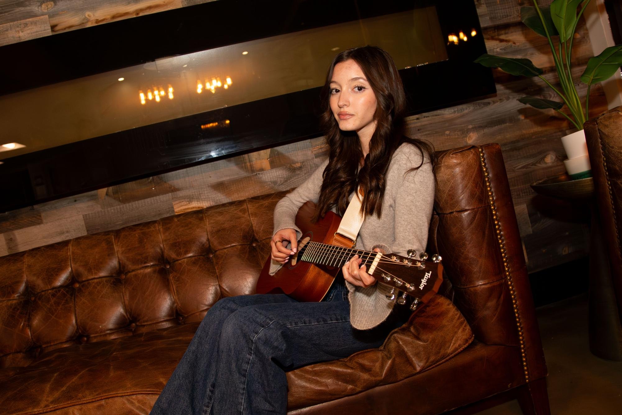 Advertising sophomore Kylie Hernandez plays the guitar on Feb. 12, 2024. She is signed to UT’s student-run record label, UTalent Records and will release her debut country album in April.