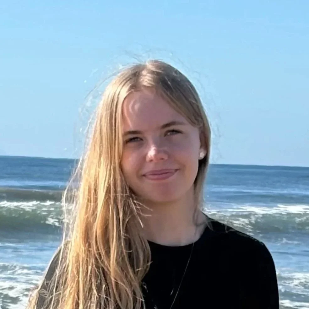 Tatum standing in front of ocean