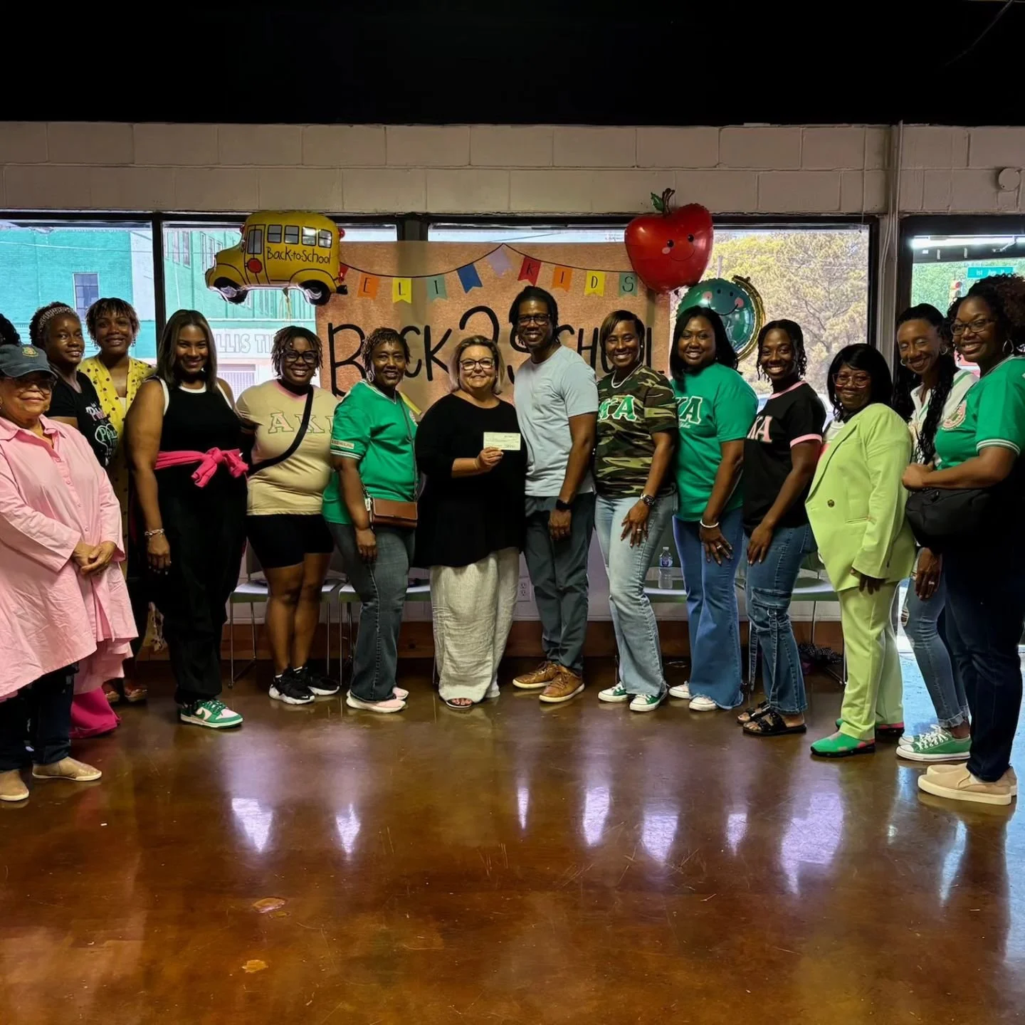 What an awesome day serving the community alongside Eli Thrive,UAB Football Team, and Cross Point Church.  Alpha Beta Xi Omega presented a check to Eli Thrive, assisted families with shopping for back to school items and registering to vote.