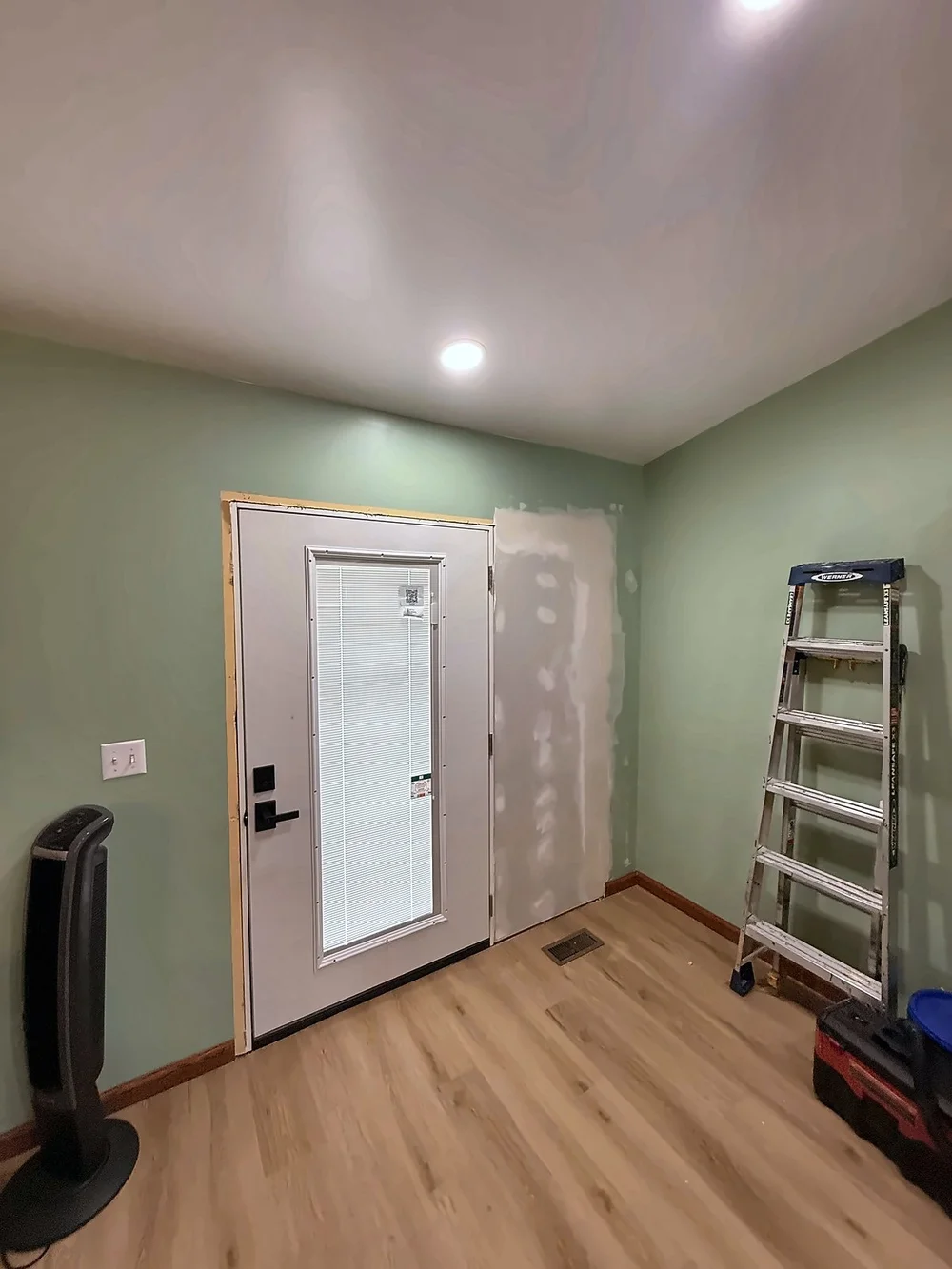 Drywall patched and mudded beside the new back door