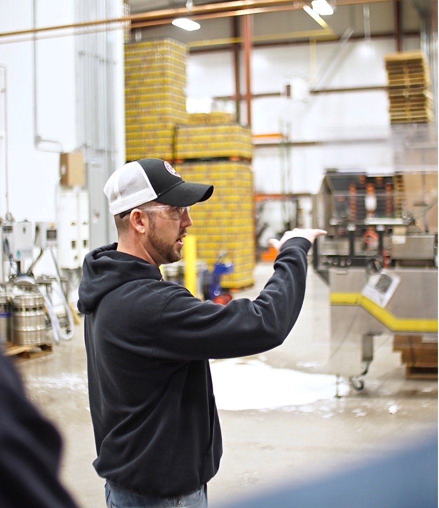 Brew master giving a tour of the brewery.