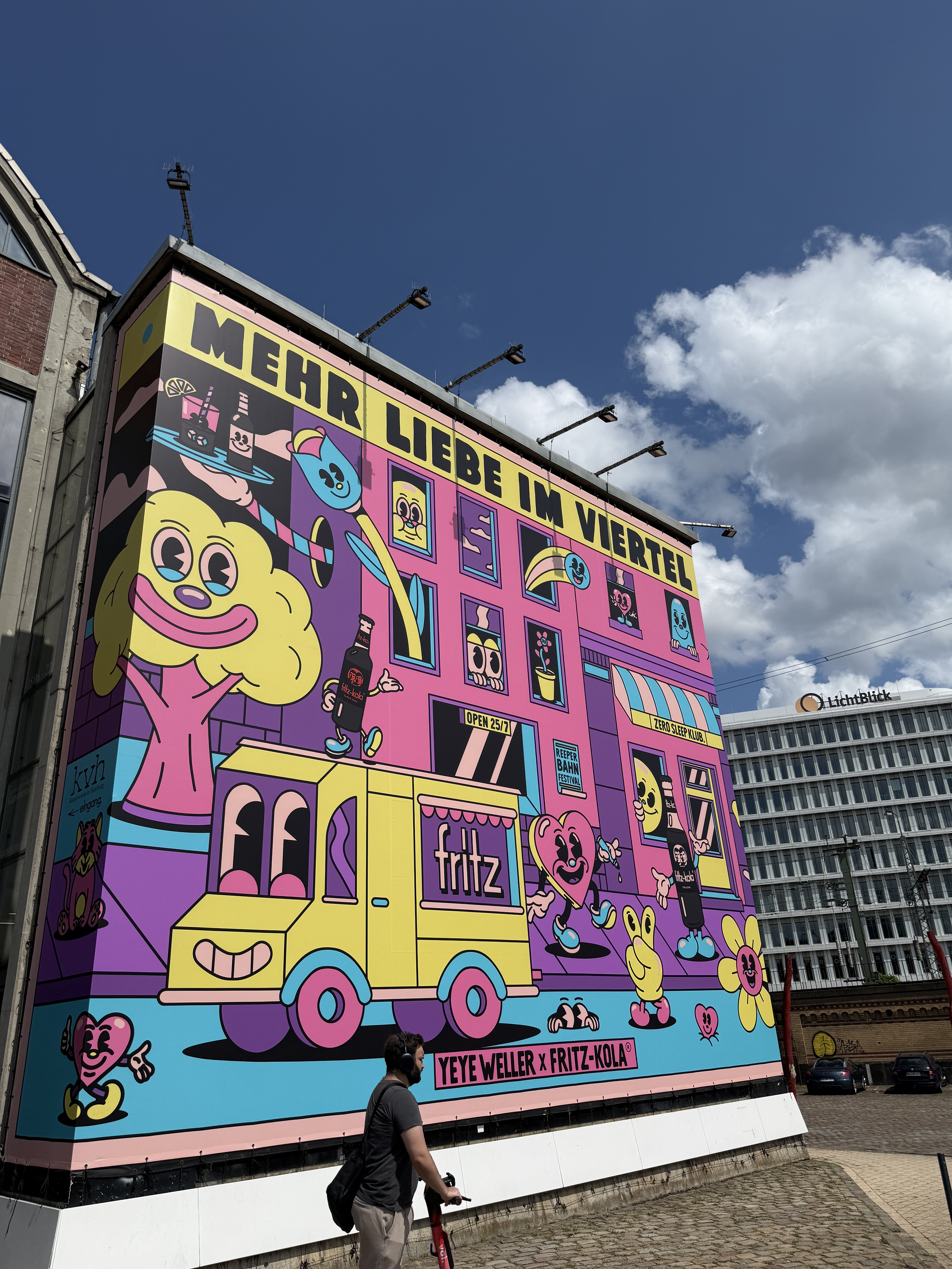 Mural by Yeye Weller, a bold, colorful, and joyful artist duo from Münster, Germany and represented by Totally Reps.