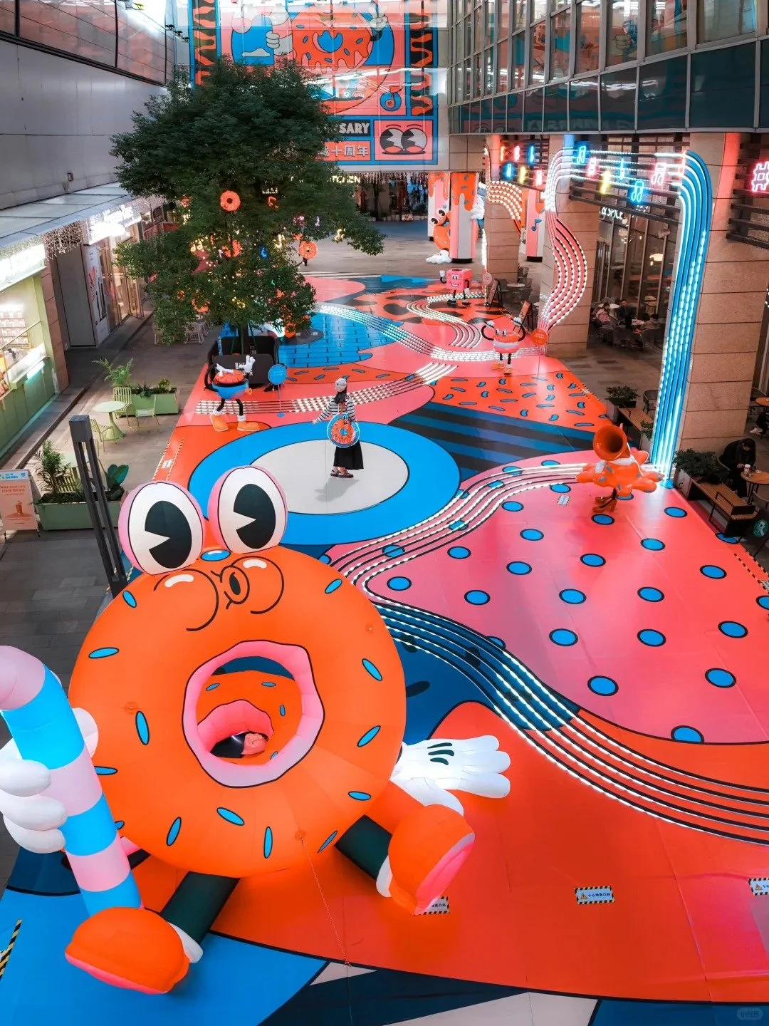 Mural by Yeye Weller, a bold, colorful, and joyful artist duo from Münster, Germany and represented by Totally Reps.