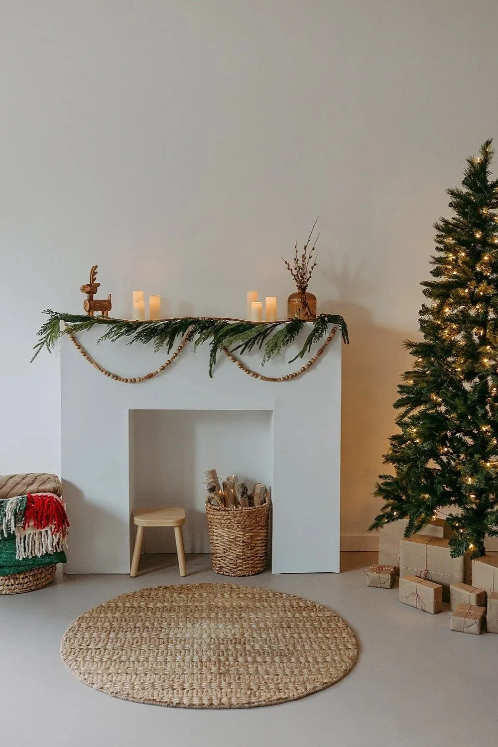 Indoor Studio Christmas set-up with fireplace and christmas tree.