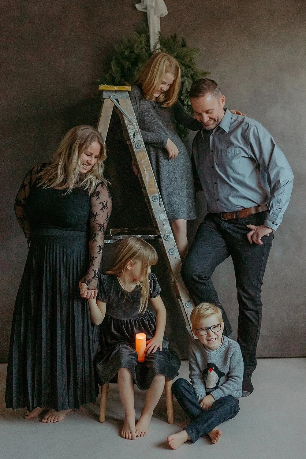 Beautiful lime wash grey backdrop for christmas family photos.