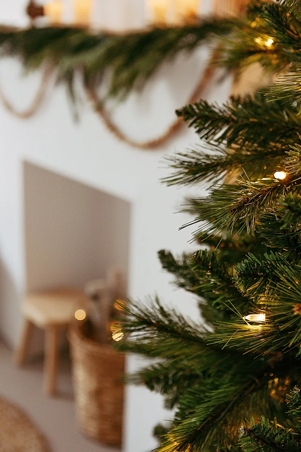 Cozy Christmas mini session set-up with fireplace and tree lights.