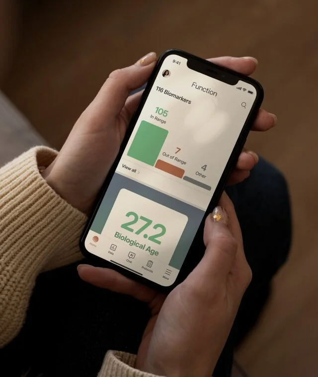 Function Health mobile app dashboard displaying biomarker results, health insights, and biological age tracking for comprehensive lab testing and personalized wellness monitoring.