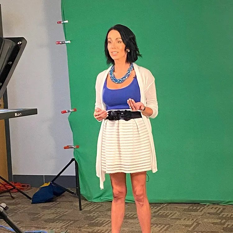 DM filming in front of green screne.jpg