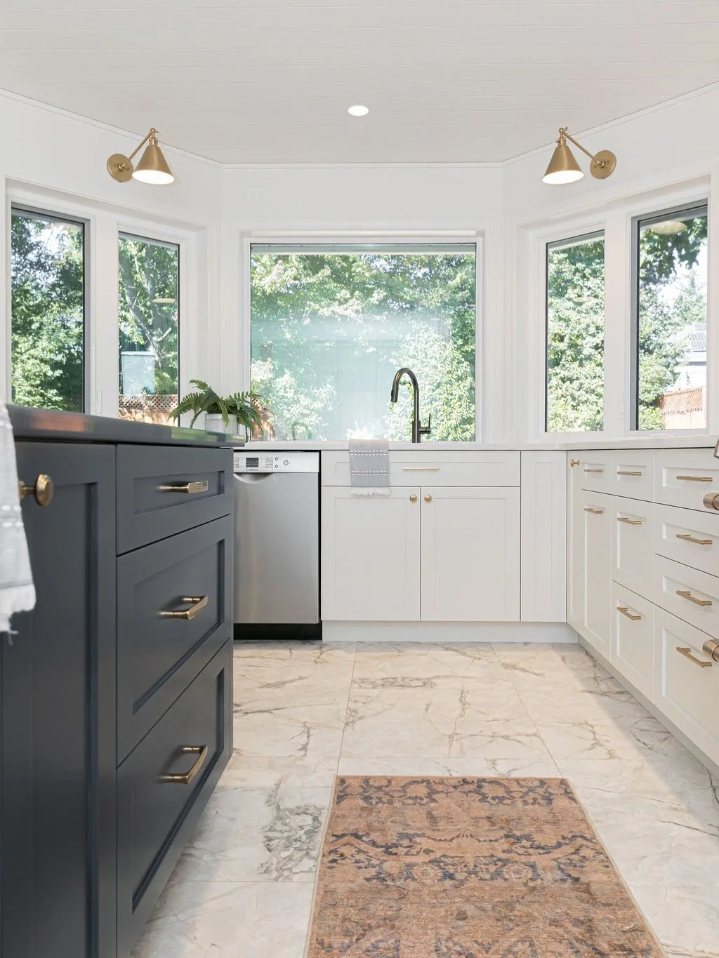 Step into style with our latest kitchen renovation! 🩶 

This stunning charcoal gray island is the perfect blend of form and function, elevating the entire space. 

The shiplap ceiling adds a touch of visual interest, seamlessly connecting the kitche