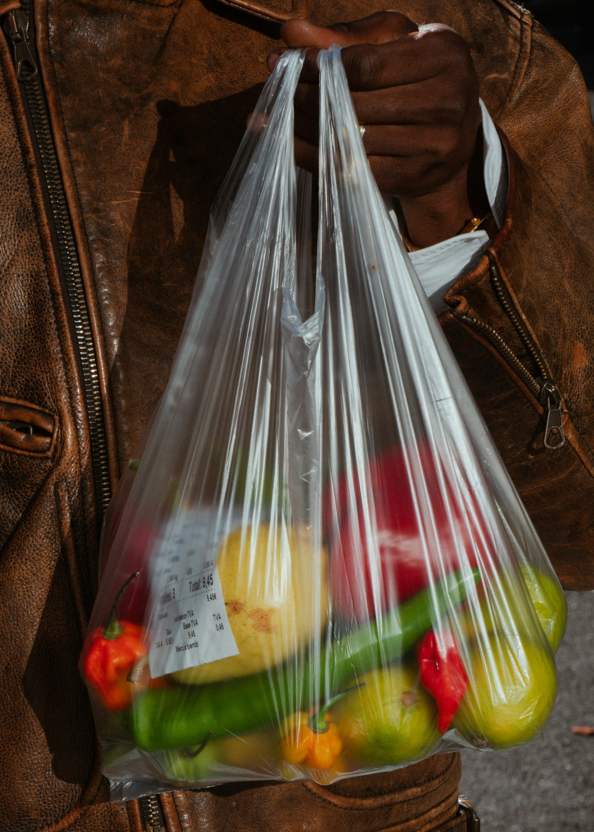 Person Carrying Produce in a Grocery Bag | Food that are near plastic can cause endocrine-disrupting chemicals!